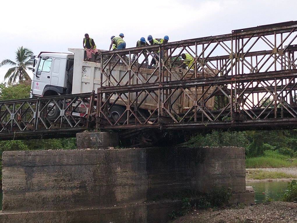 A temporary access road has been constructed under the bridge to allow trucks to cross the river and continue journeys to and from Auki.