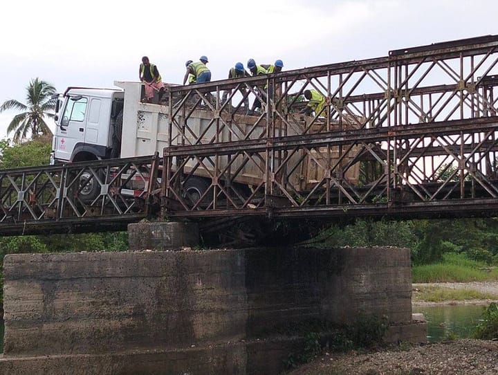 A temporary access road has been constructed under the bridge to allow trucks to cross the river and continue journeys to and from Auki.